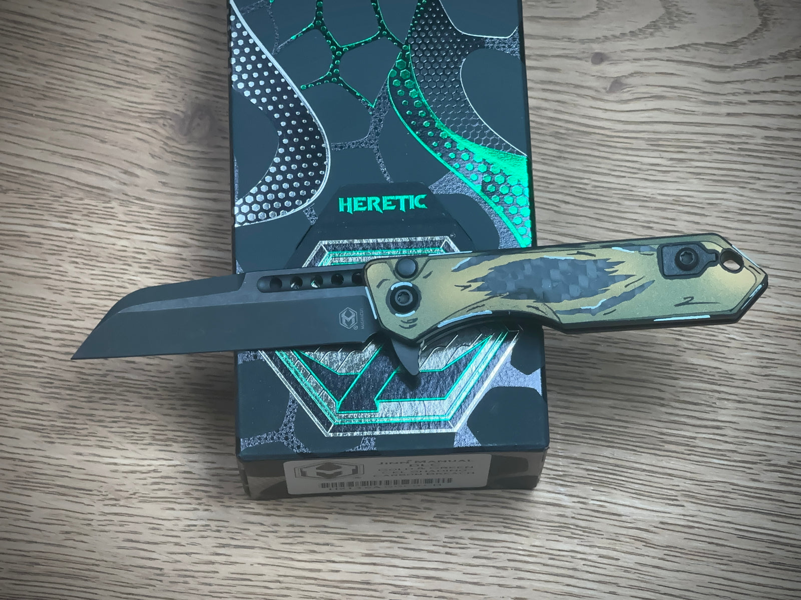 Heretic Knives Jinn Manual Button Lock (Gold & Green Cel Shade Carbon Breach)
